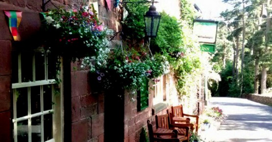 Picture of the outside of the Ship Inn at Wincle bathed in summer sunshine